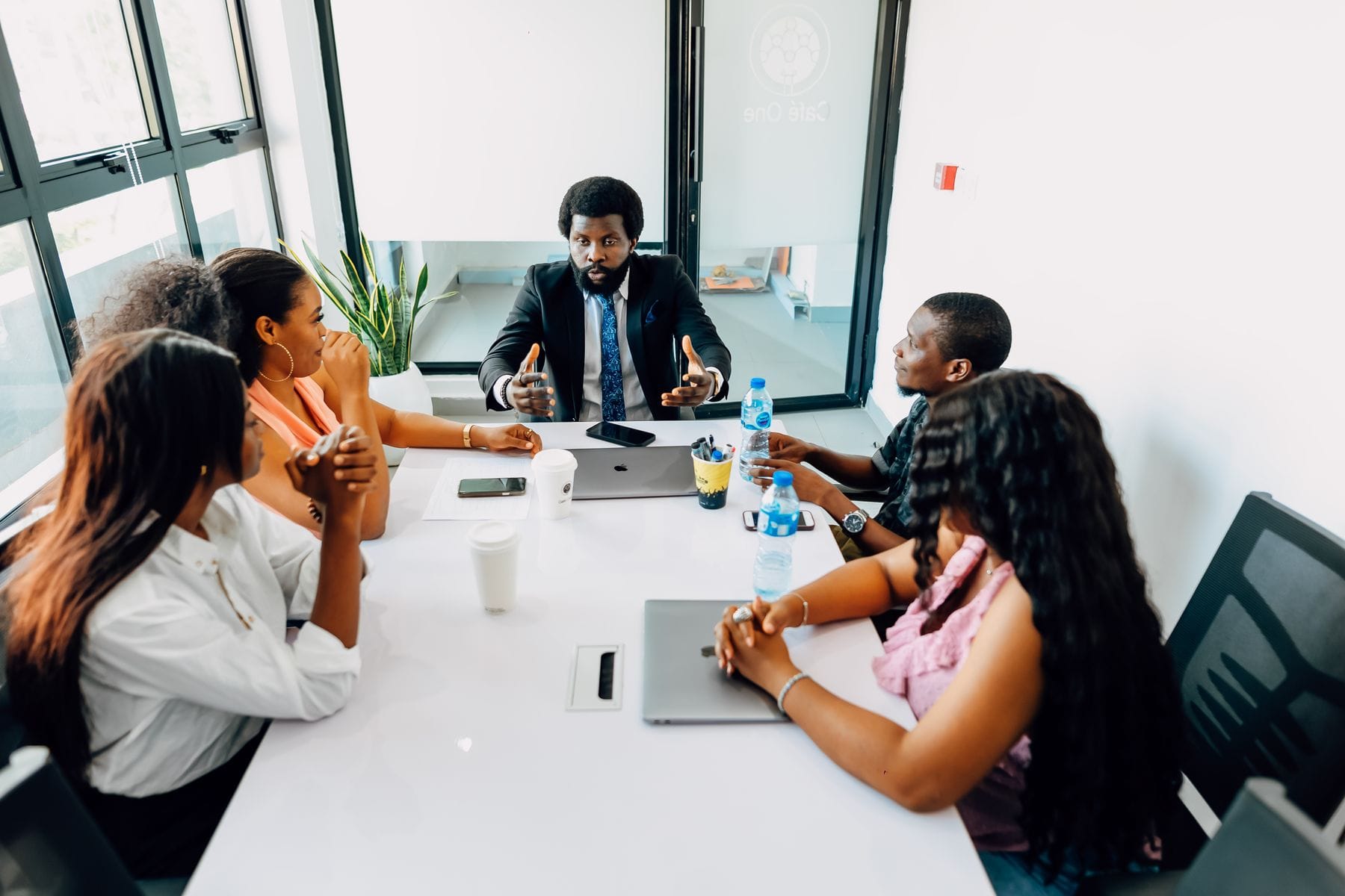 African corporate team aligning around a shared organisational message in a Lagos office